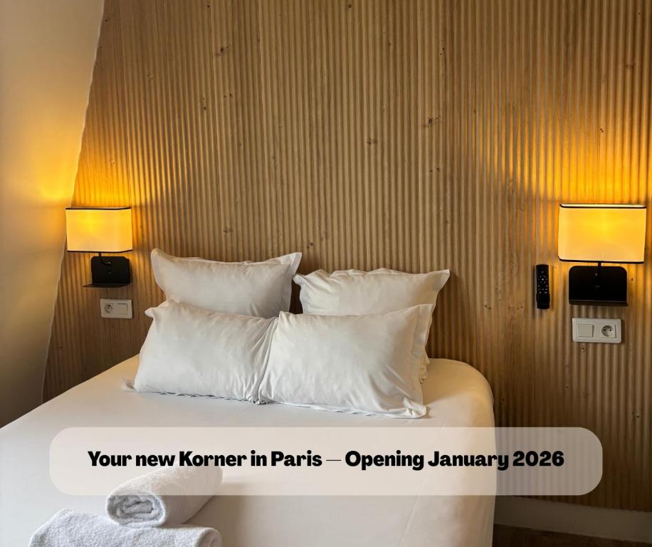 a bedroom with a bed with white pillows at Korner République in Paris