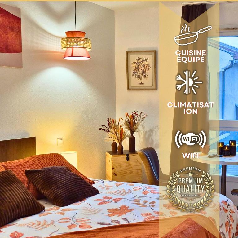 a bedroom with a bed with a sign on the wall at L'Ambre - Moderne - Equipé - Douche in Lourdes