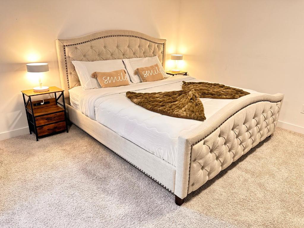 a bedroom with a large white bed with a blanket at Cozy and Spacious Suite - Private Ensuit Bath - King Bed - Ultra Fast Wifi - Free Parking - Smart TV in Rockland