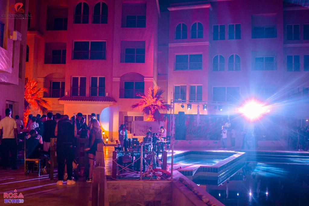 a group of people standing in front of a building at Rosa Boho Hotel And Aqua Park in Hurghada
