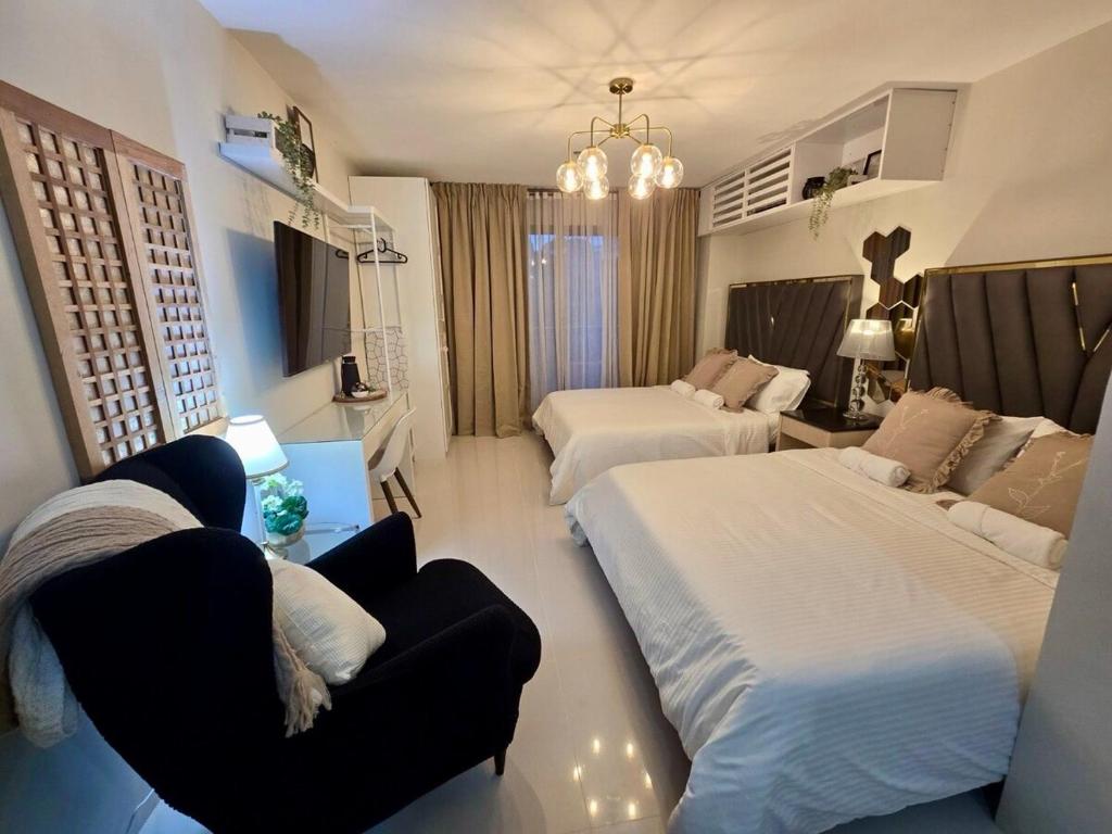 Postel nebo postele na pokoji v ubytování Alpine Villas at Crosswinds Tagaytay