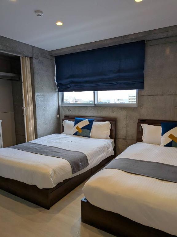 Giường trong phòng chung tại Arahastay