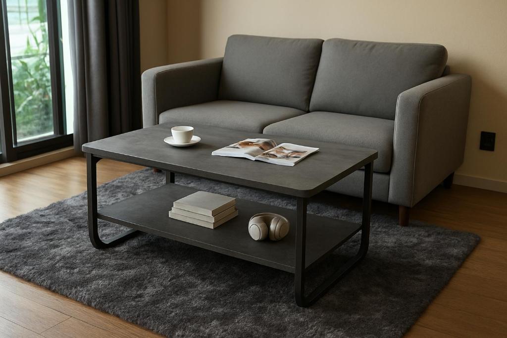 a living room with a couch and a coffee table at The Central Escape Phuket in Ban Rangeng