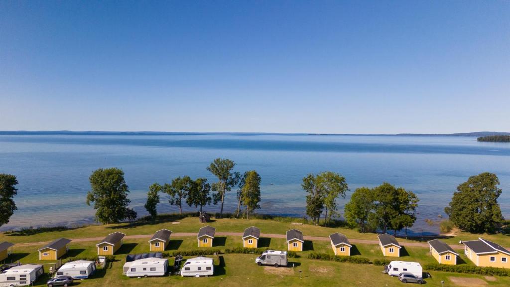 an aerial view of a group of camper vans on a hill next to at First Camp Vadstena - Vättern in Vadstena