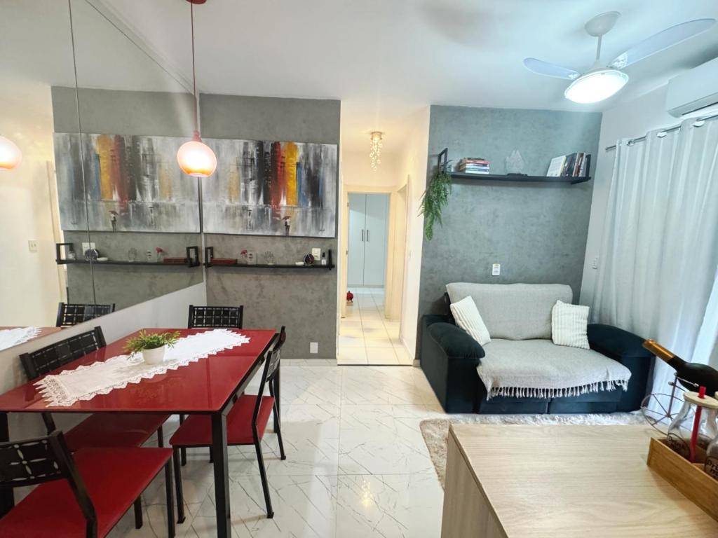 a living room with a table and a couch at Apartamento Belem Cop30 proximo ao aeroporto #belem #Cop 30 #aeroporto in Belém