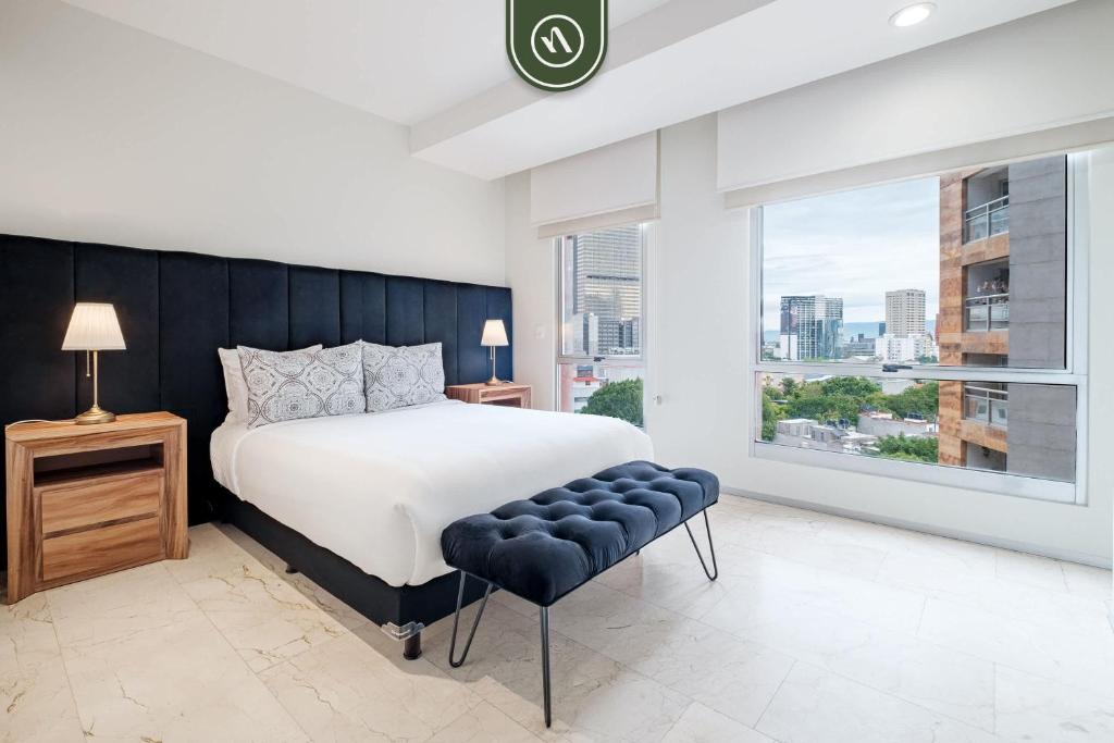 Ένα ή περισσότερα κρεβάτια σε δωμάτιο στο Redesigned 1BR Condo in Polanco - Pool Gym - Padel