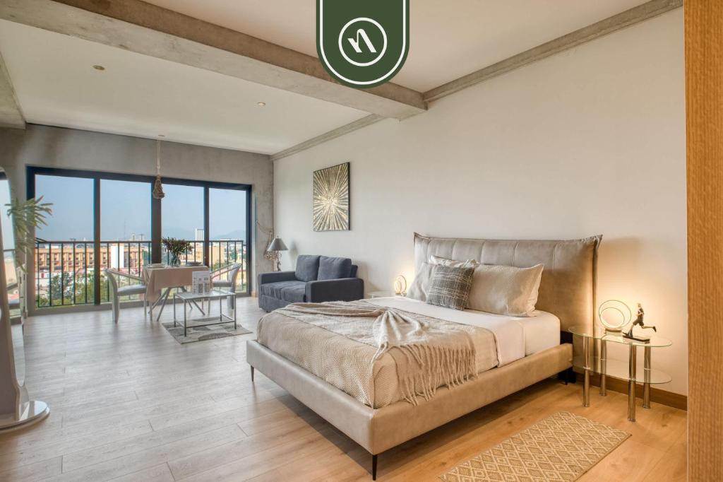 En eller flere senge i et værelse på Stunning 1 BR Condo - Alameda Central - Downtown