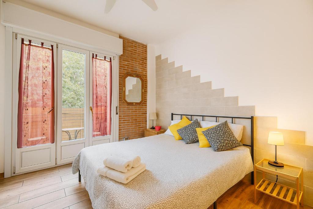 a bedroom with a bed and a staircase at Europe Station House in Parma