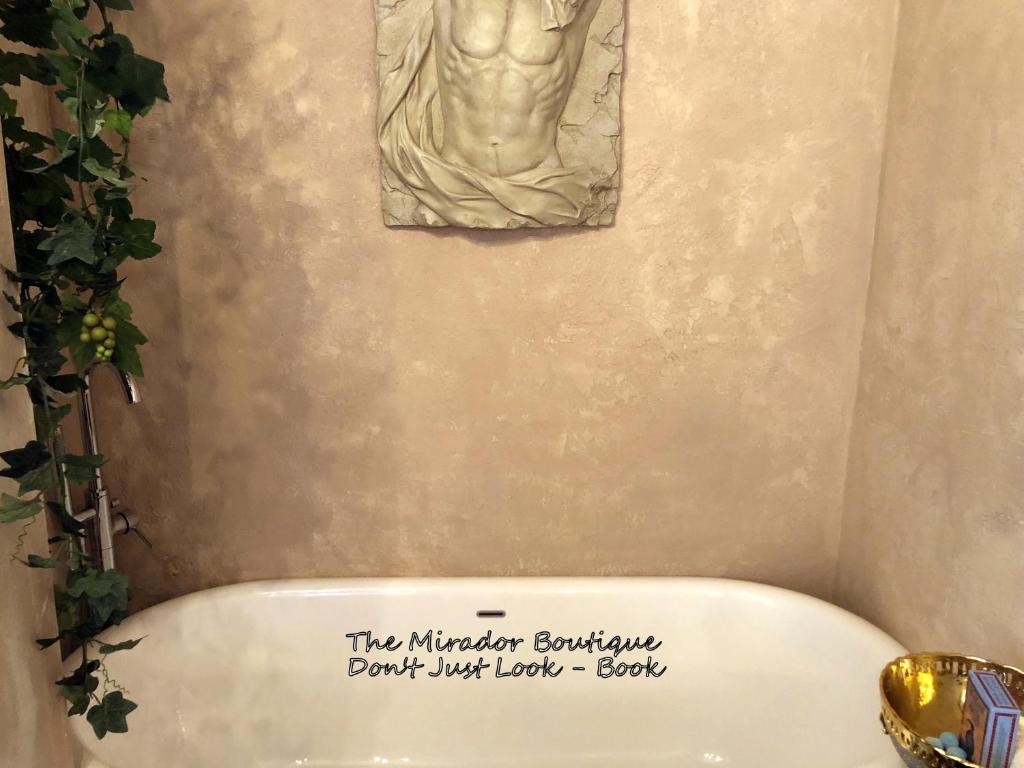 a sign on the top of a toilet in a bathroom at Spend this night in Venice whilst visiting Swansea in Swansea