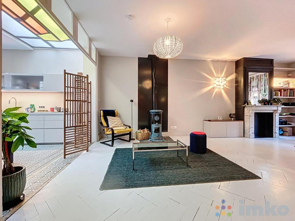 a living room with a couch and a table at Anavel Atao in Lille