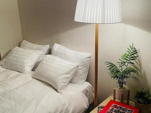 Ένα ή περισσότερα κρεβάτια σε δωμάτιο στο 인천공항 게스트하우스