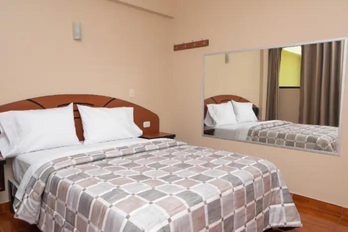 Ένα ή περισσότερα κρεβάτια σε δωμάτιο στο hotel opera