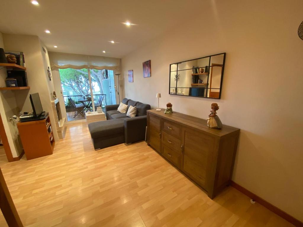 a living room with a couch and a table at Apartamento Rocio en Calella in Calella de Palafrugell
