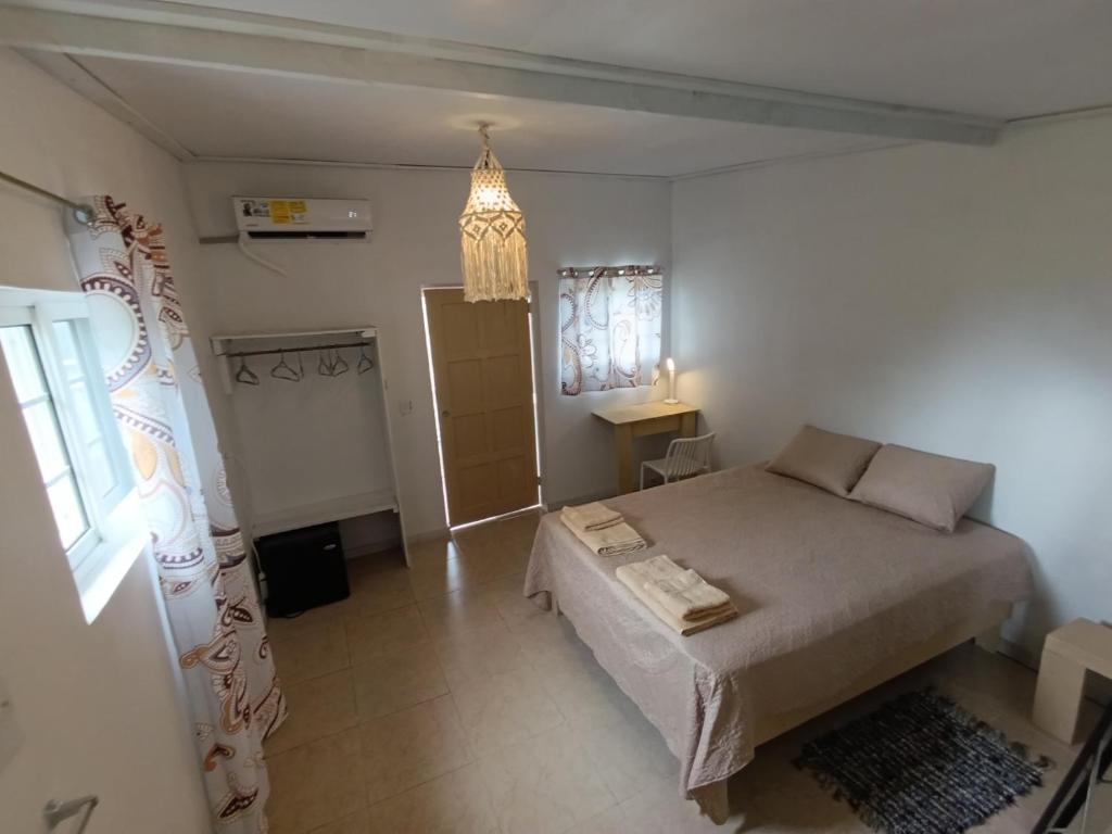 a bedroom with a large bed in a room at cabanita Celeste in Boca Chica