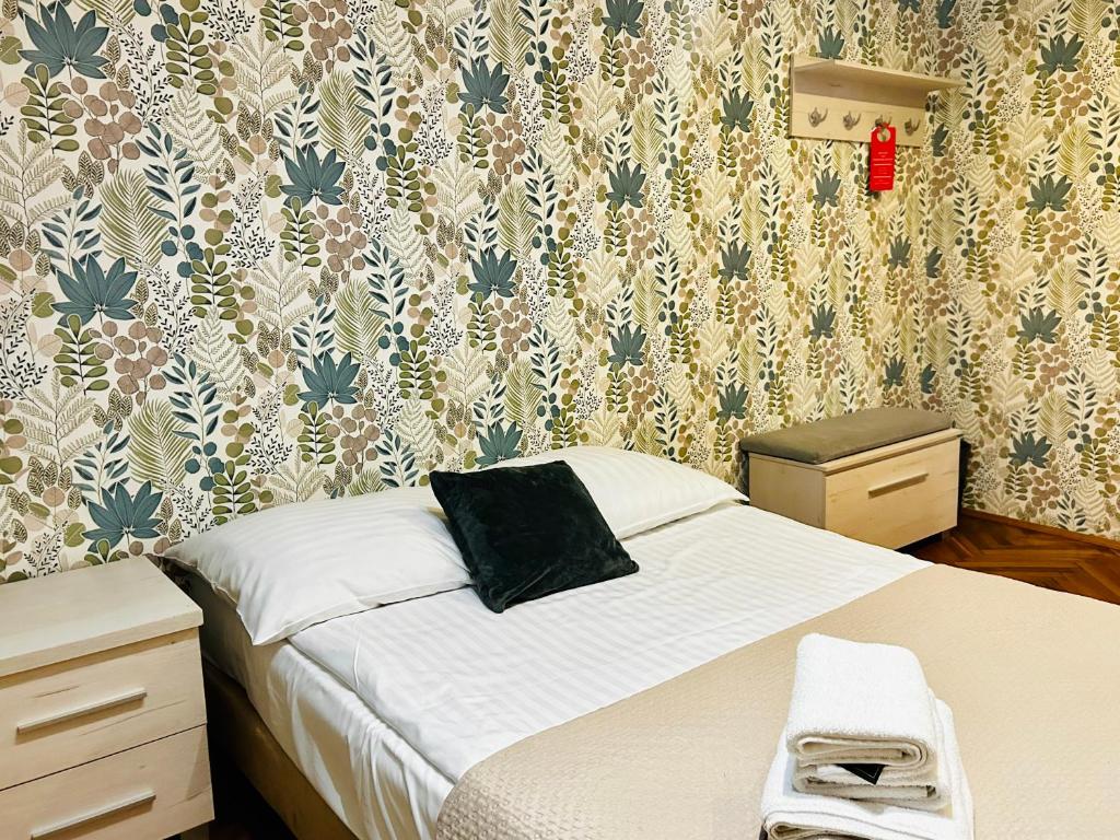 Ένα ή περισσότερα κρεβάτια σε δωμάτιο στο Stary Młyn