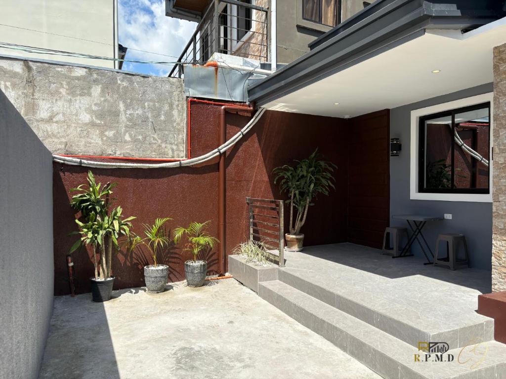 a courtyard of a building with potted plants at CJ Apartments-III in Olongapo