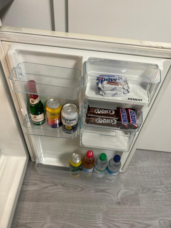 an open refrigerator filled with food and drinks at Schönes Apartment mit Doppel- oder 2 Einzelbetten 2 Per -Sophie-Scholl-Str 4 in 71717 Beilstein in Beilstein