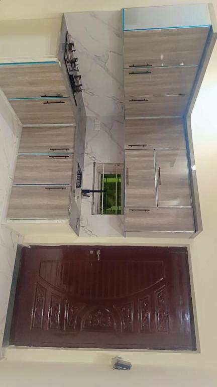 a room with three drawers and a window in the ceiling at Canal road in Faisalabad