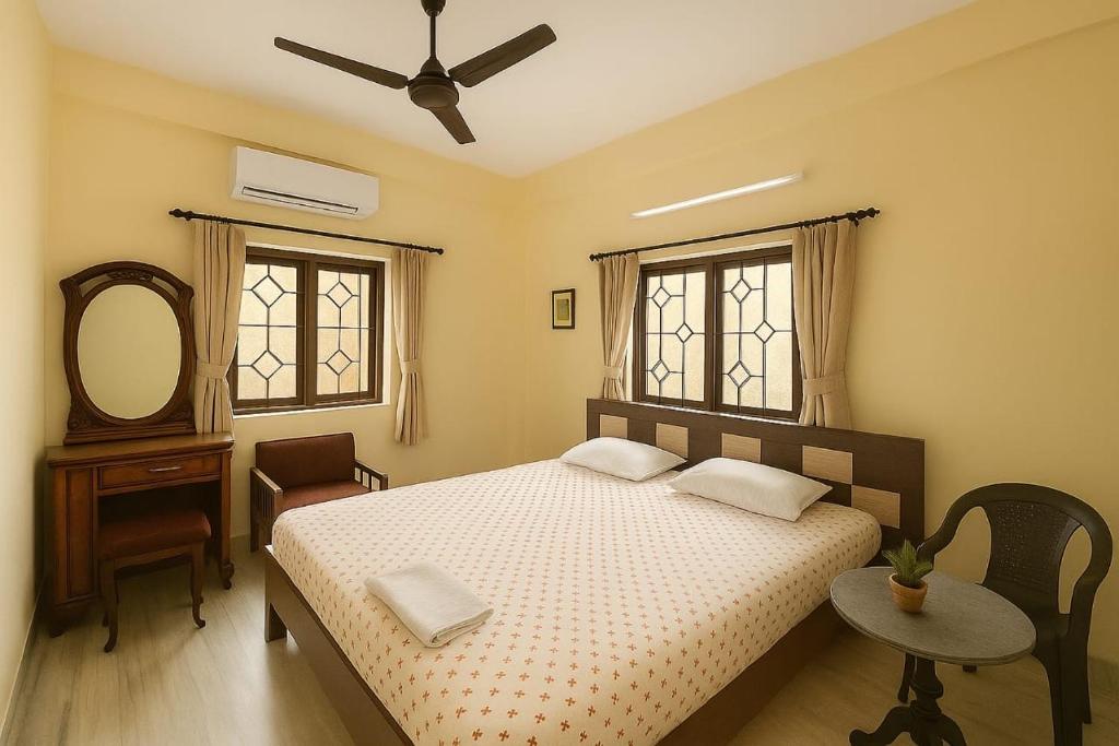 Ένα ή περισσότερα κρεβάτια σε δωμάτιο στο Shanti Niwas Apartment