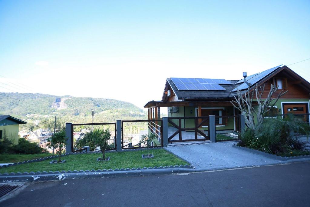a house with a solar panel on the roof at Casa Petri Gramado in Gramado