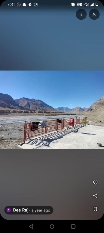 a screenshot of a phone screen with a view of the desert at Home stay in Kaza