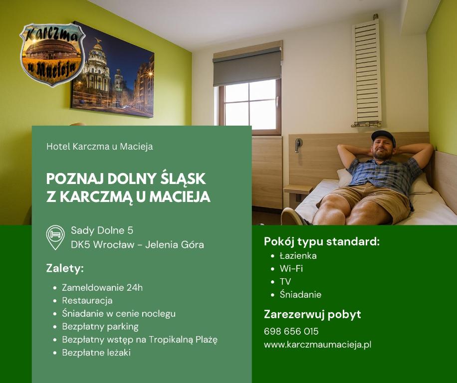 a man laying on a bed in a room with a poster at Hotel Karczma u Macieja in Bolków