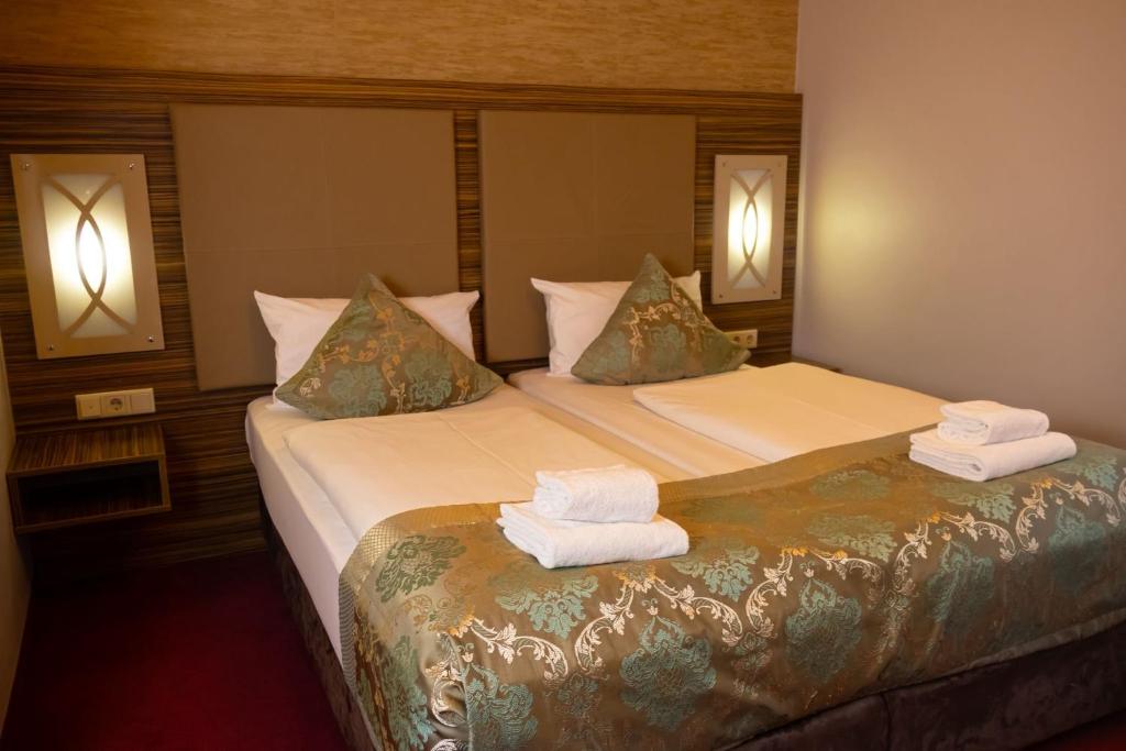 Ένα ή περισσότερα κρεβάτια σε δωμάτιο στο Hotel Villa Erlen