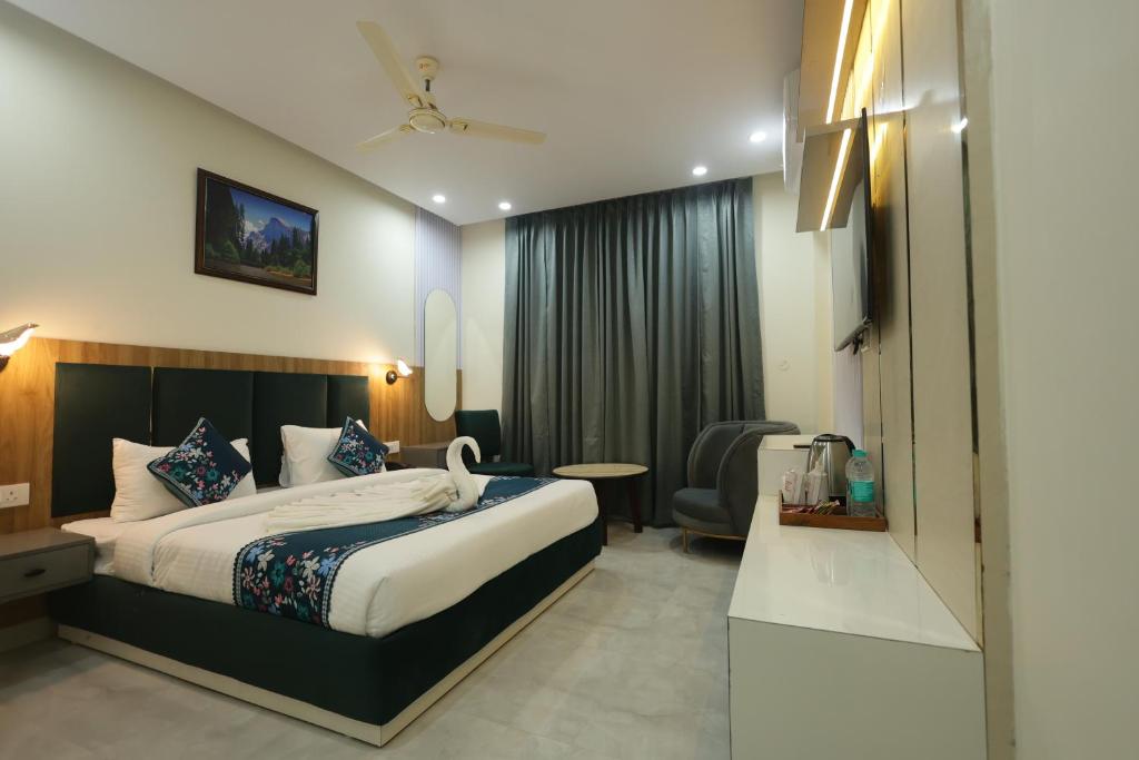a hotel room with a bed and a chair at Roots & Peaks in Rishīkesh