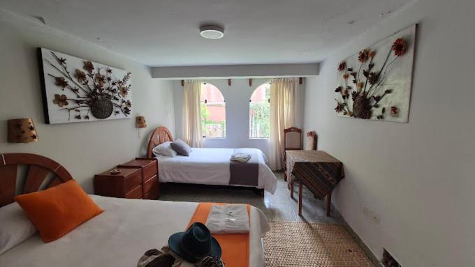 Ένα ή περισσότερα κρεβάτια σε δωμάτιο στο CasaDePaz Samay Wasi