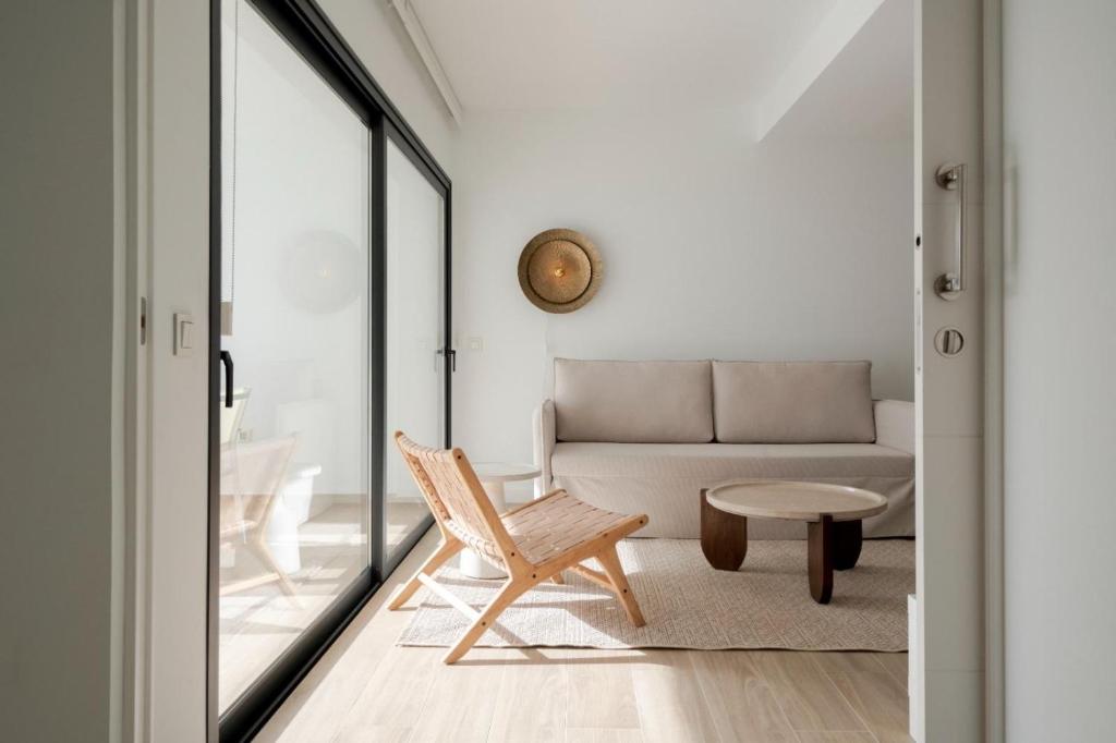 a living room with a couch and a table at Casa Tester by FTV HOLIDAYS HOMES in Villaverde