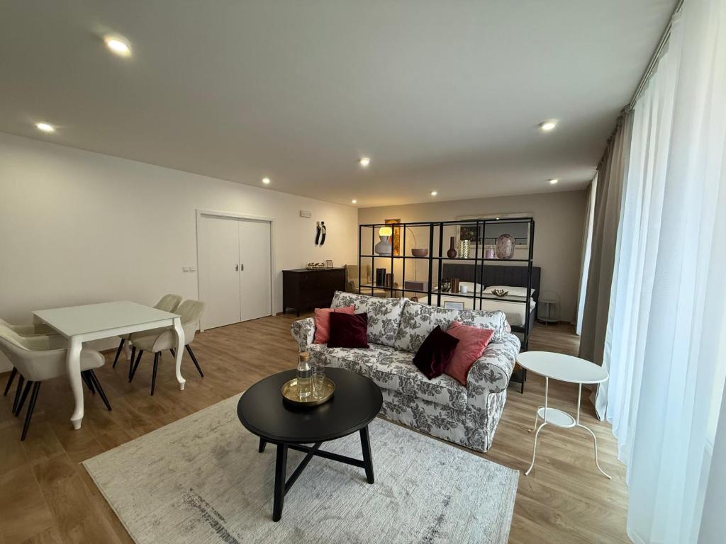 a living room with a couch and a table at Veleslaveenka in Plzeň