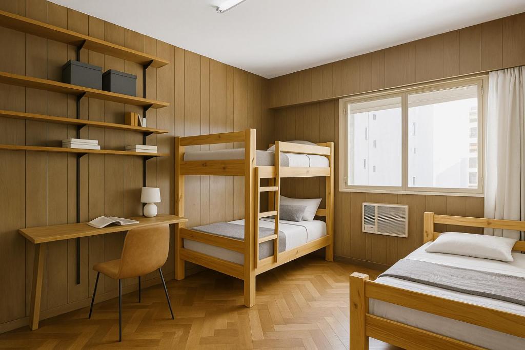 Ένα ή περισσότερα κρεβάτια σε δωμάτιο στο Hermoso departamento con vista a Obelisco lV