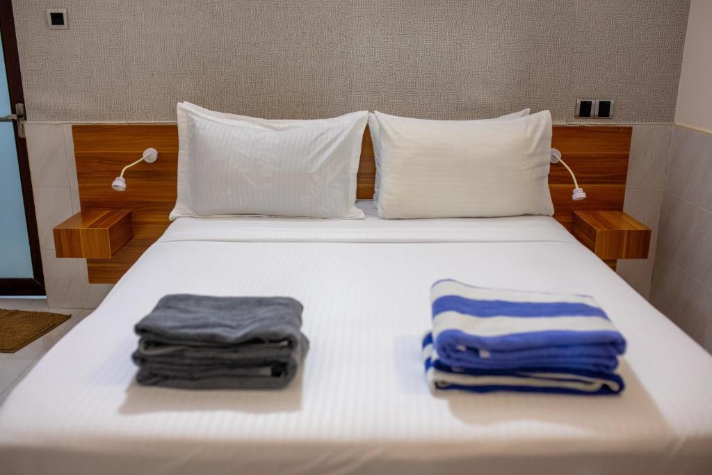 Postel nebo postele na pokoji v ubytování Lux Hotel Mathiveri