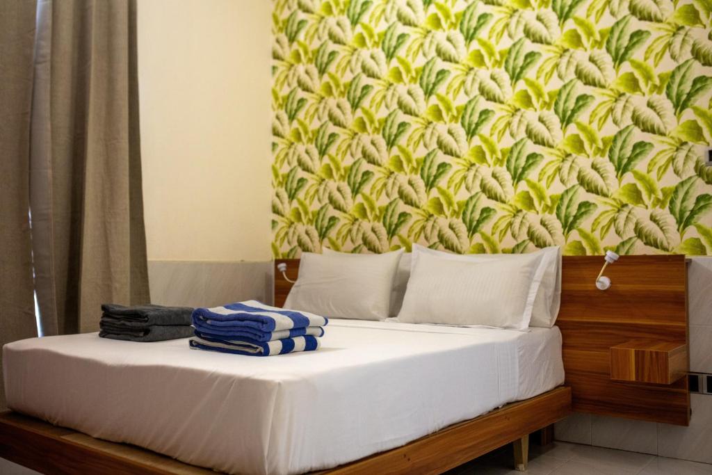 Ένα ή περισσότερα κρεβάτια σε δωμάτιο στο Lux Hotel Mathiveri