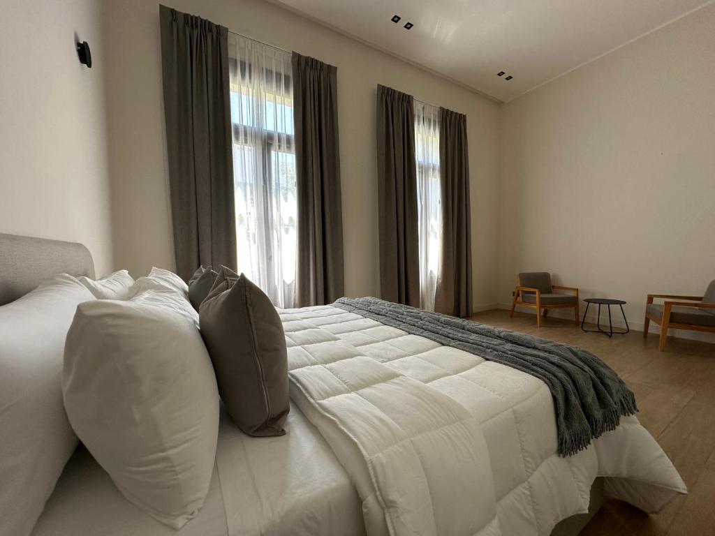 Postel nebo postele na pokoji v ubytování Hotel Boutique Ubuntu