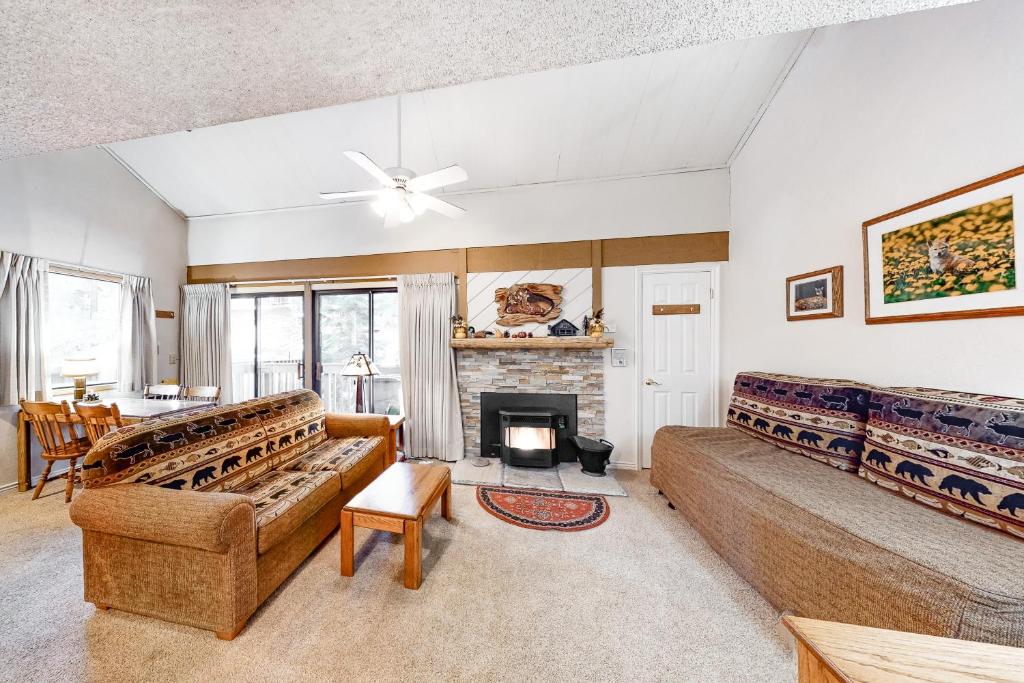 a living room with a couch and a fireplace at Hidden Valley 26 D in Mammoth Lakes