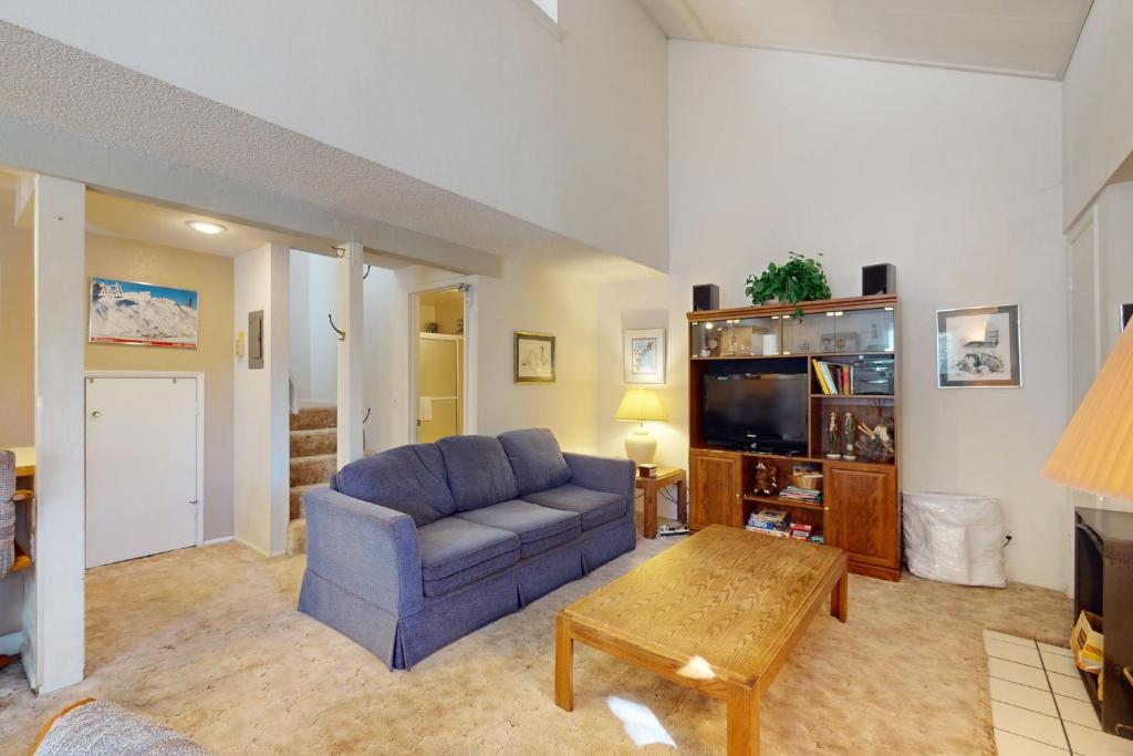 a living room with a couch and a tv at Hidden Valley 30 D in Mammoth Lakes