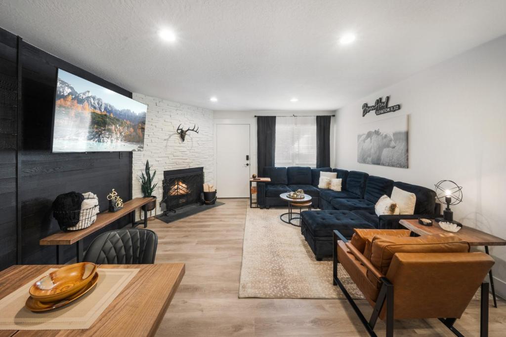 a living room with a couch and a fireplace at The Drift in Brian Head