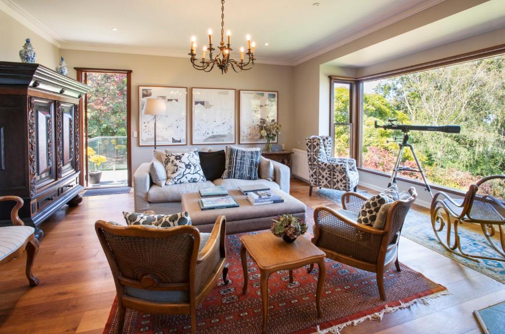 a living room with a couch and chairs at Boyanda at Ferny Creek in Ferny Creek