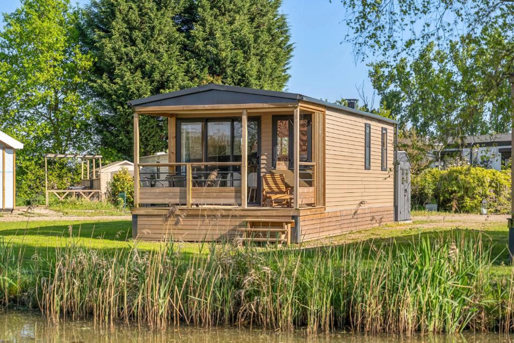 Κήπος έξω από το Camping Papillon Kinrooi - 138