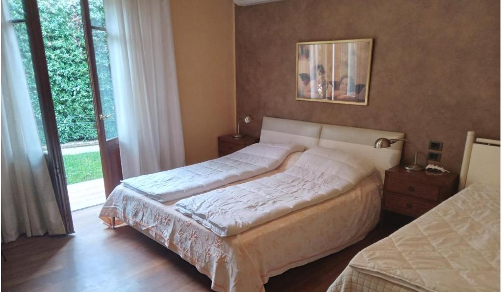 Ένα ή περισσότερα κρεβάτια σε δωμάτιο στο Family rooms with full kitchen in Lake Garda