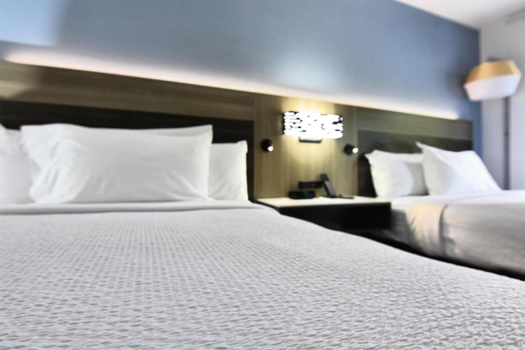 Postel nebo postele na pokoji v ubytování Best Western Point South