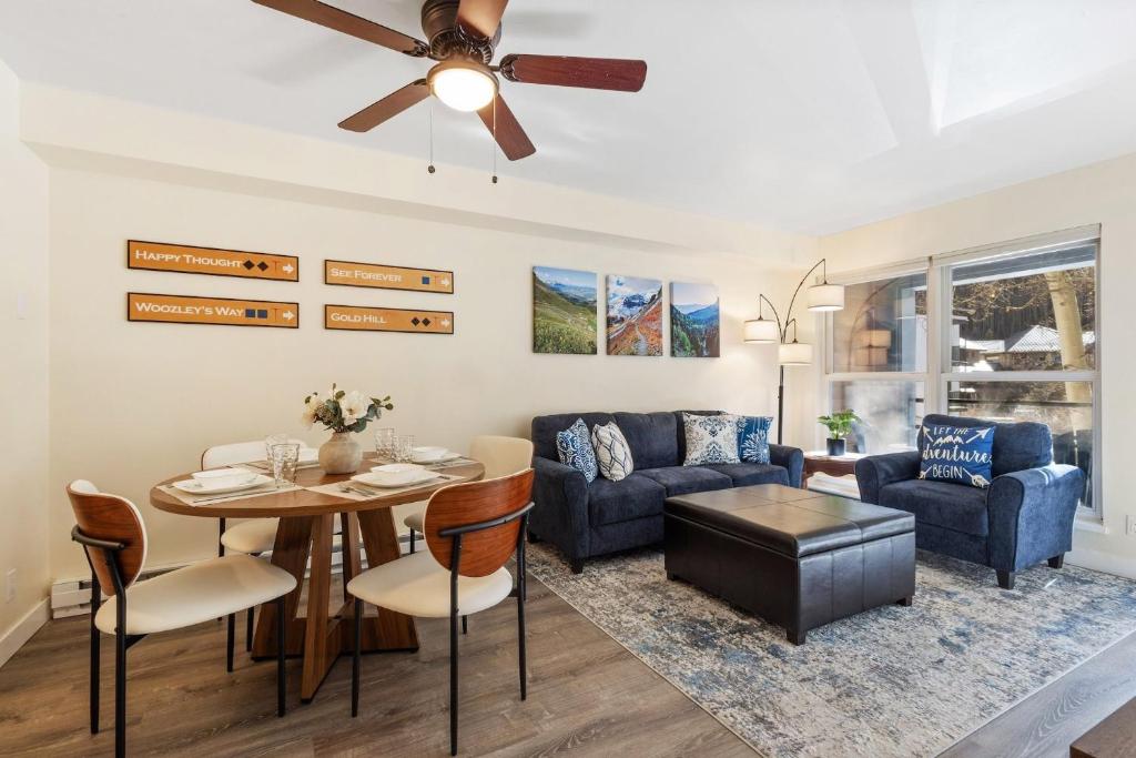 a living room with a couch and a table at Fall Line 107 condo in Telluride