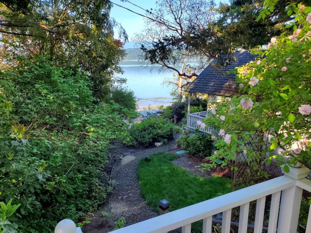a view of the ocean from the balcony of a house at Bay Cottage Getaway in Port Townsend
