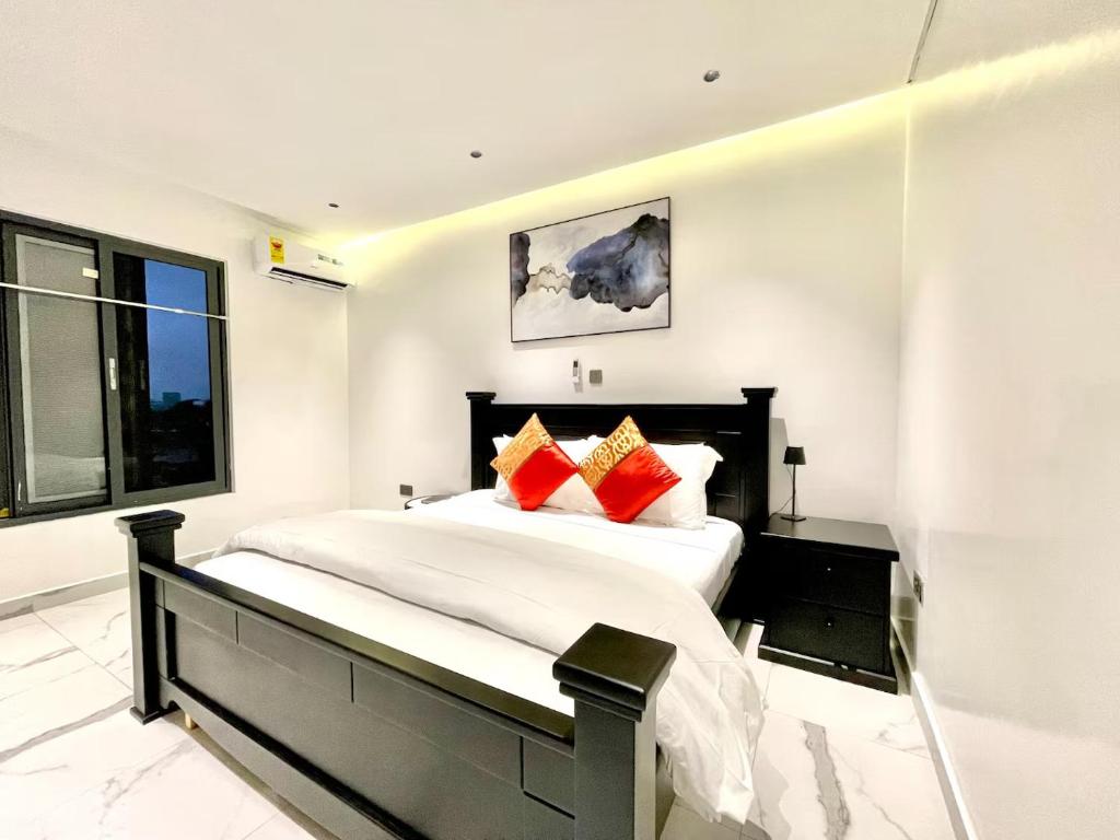 Postel nebo postele na pokoji v ubytování Cozy 1-bedroom Apartment , East Legon- 10 Minutes to Kotoka Intl Airport