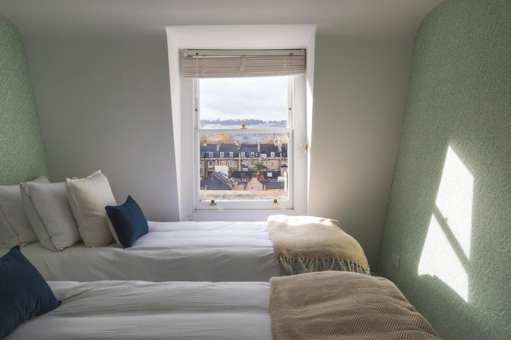 En eller flere senge i et værelse på Boutique Retreat in Central Bath