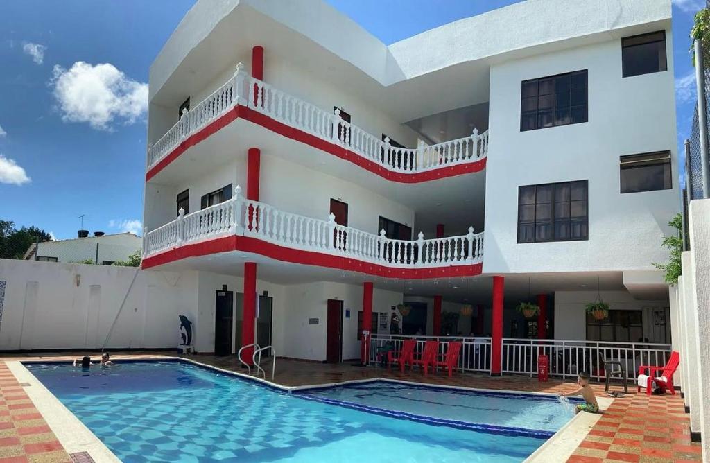 a house with a swimming pool in front of it at Hotel morada del sol 