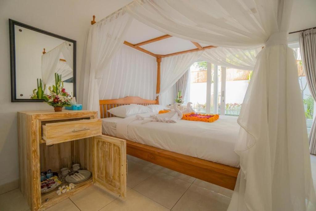 Ένα ή περισσότερα κρεβάτια σε δωμάτιο στο Deluxe room near seminyak beach