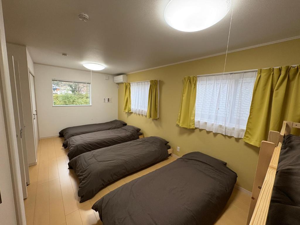 Ένα ή περισσότερα κρεβάτια σε δωμάτιο στο A home Toki2