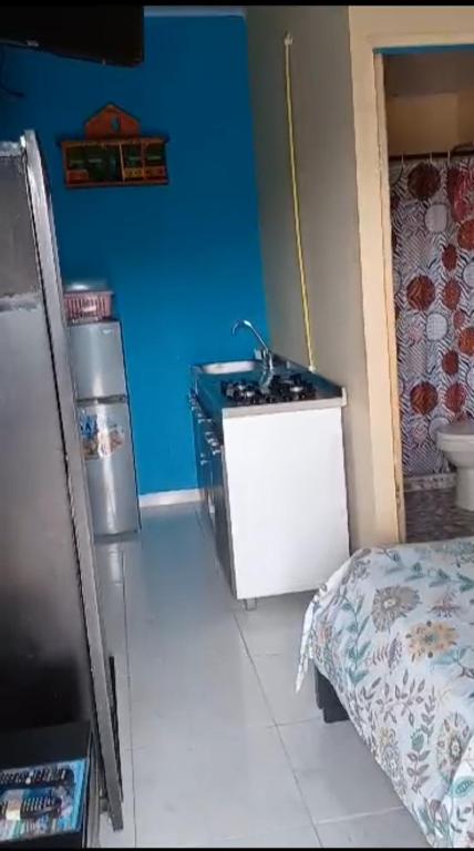 a bathroom with a sink and a bed in a room at Ann Dor #3 in San Andrés